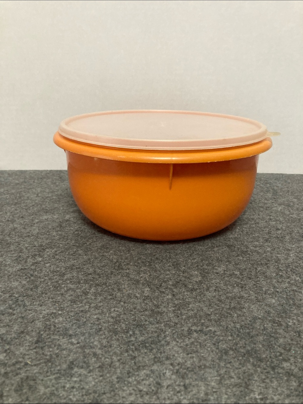 Vintage Tupperware mix and store bowl orange made in the USA lid included